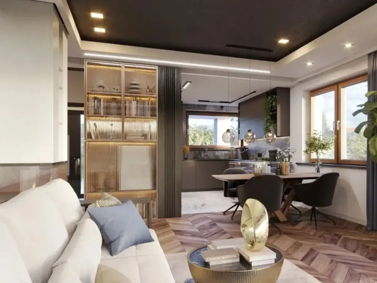 Nowoczesne wnętrze z salonem i aneksem kuchennym. Zastanawiasz się, ile kosztuje wykończenie domu ze stanu surowego? Ten projekt pokazuje możliwości.